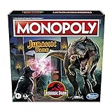 Monopoly: Jurassic Park Edition Brettspiel für Kinder ab 8 Jahren, enthält T-Rex Spielfigur, Elektronisches Tor spielt Soundeffekte und Filmmusik (ENGLISCHE Version)